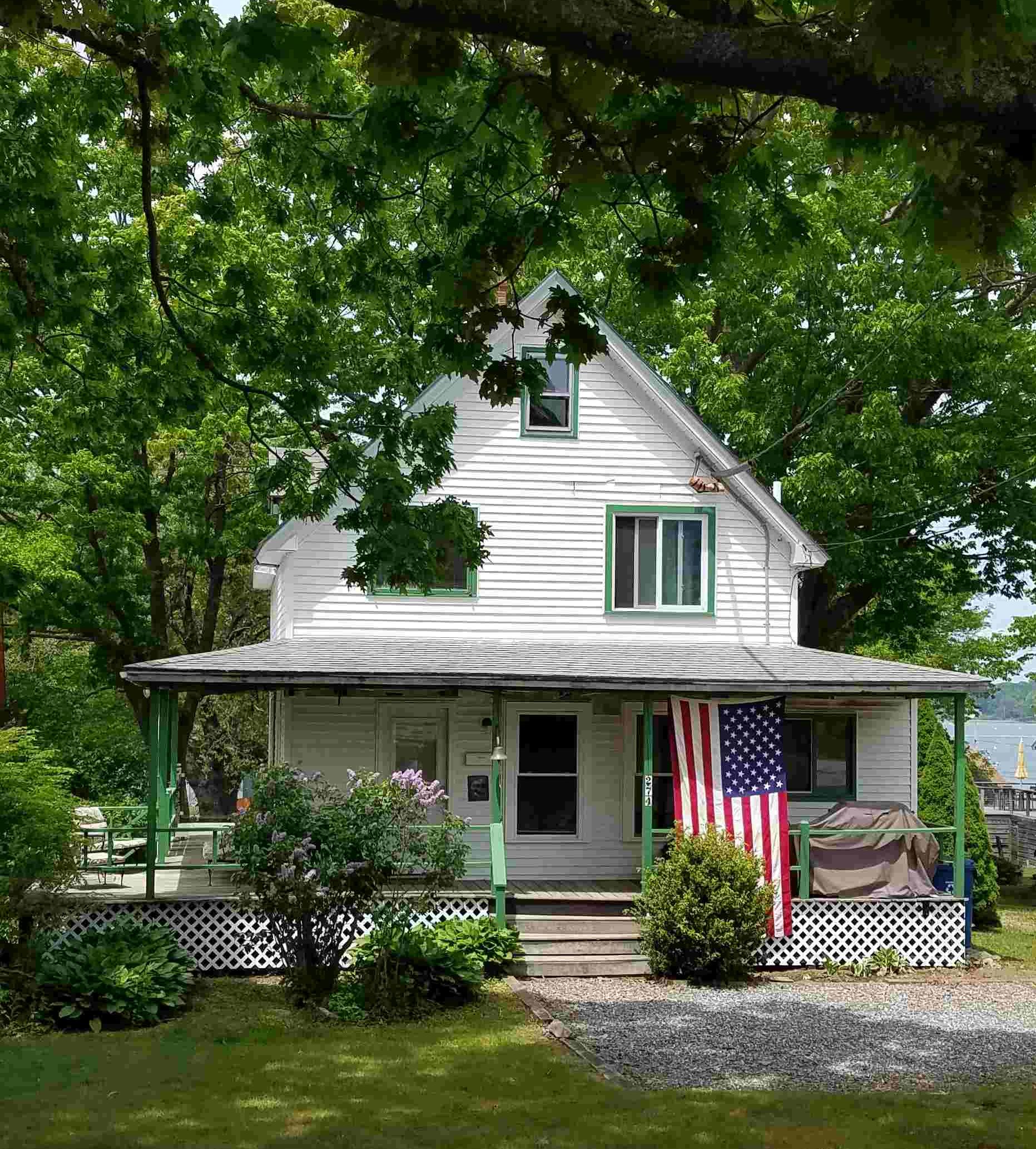 [House showing wrap-around porch]